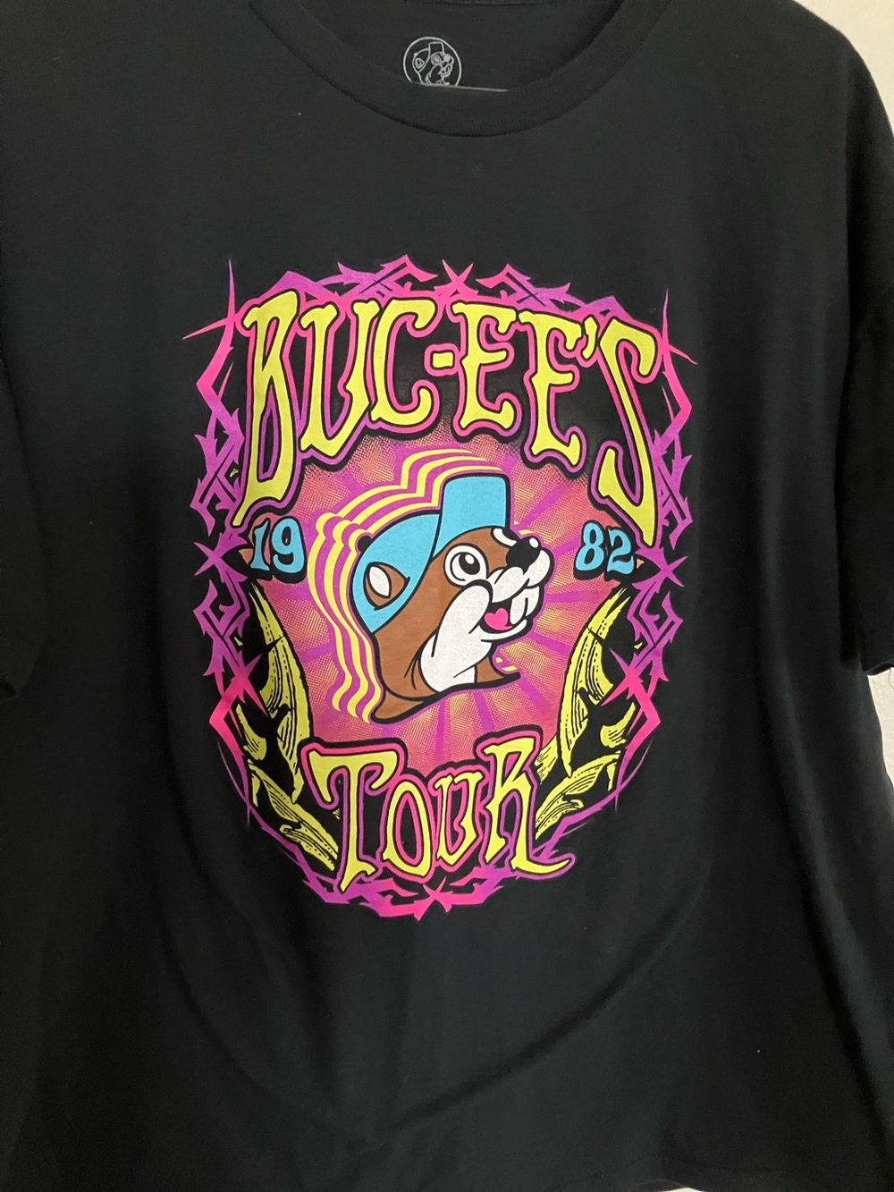 Buc-ee's Tour 1982 Black Graphic Tee - Pink, Yellow & Blue Retro Neon Design